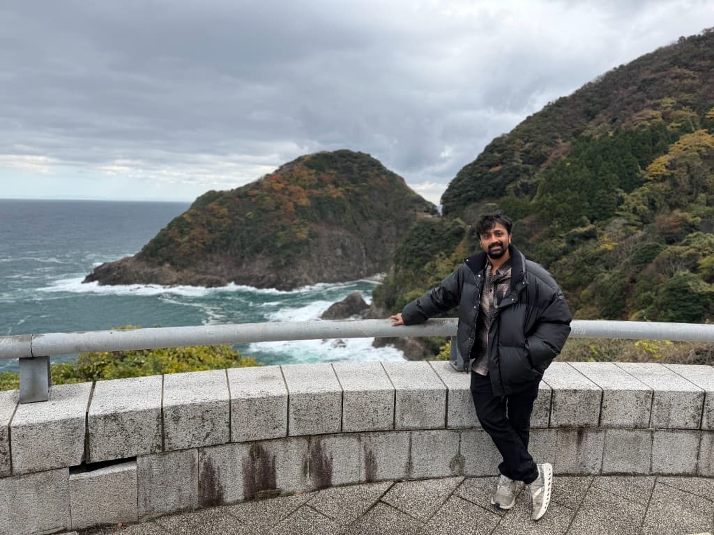 Pranav Goel outdoors by the coast